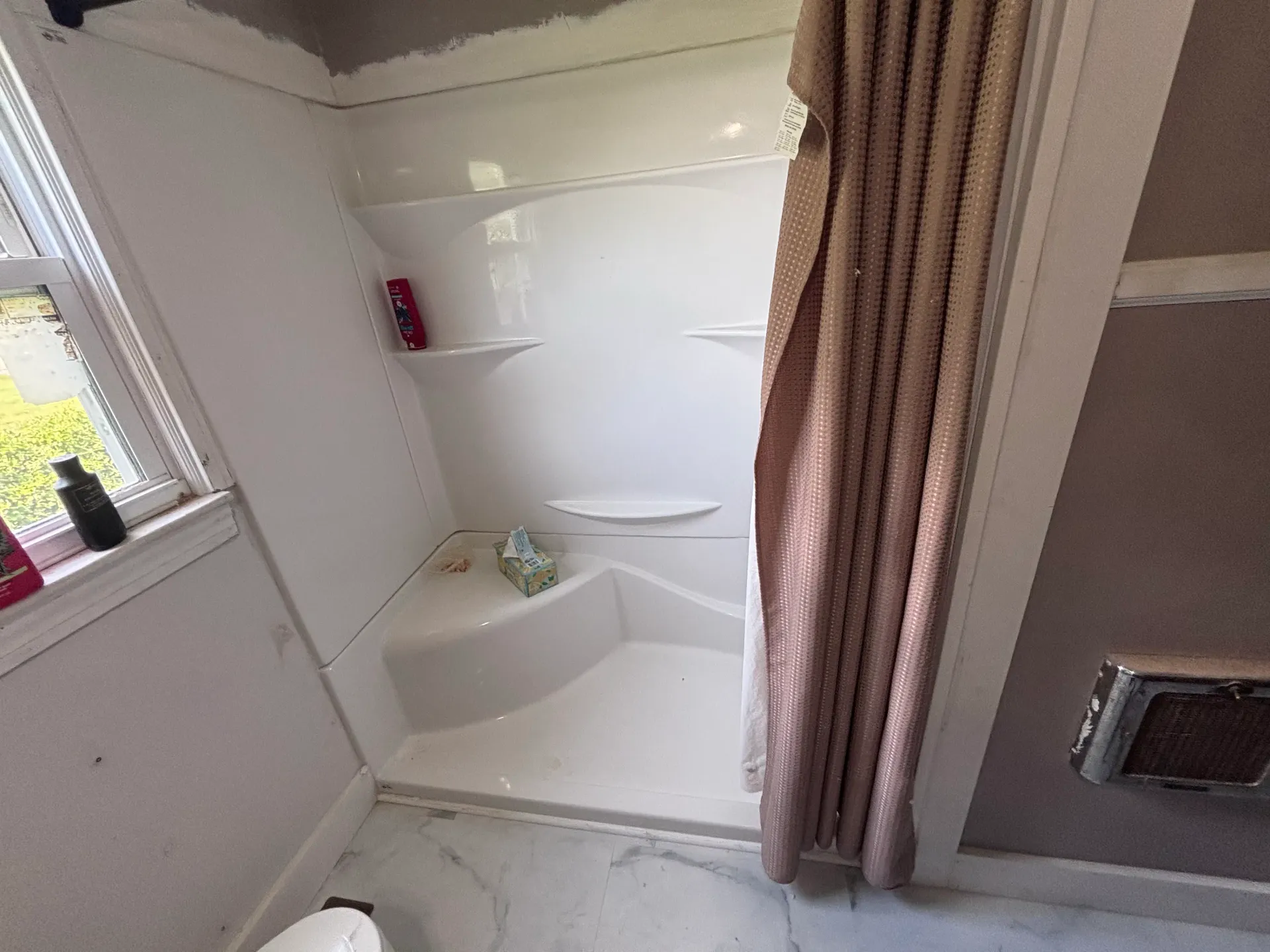 Bathroom shower surround and tub during remodel work